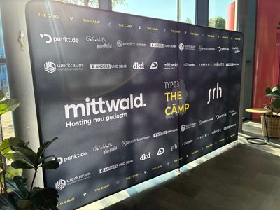 A large canvas with THE CÄMP logo and logos of all the sponsoers